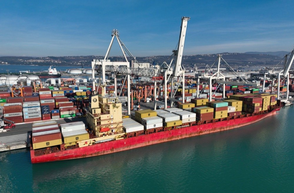 Container vessel working cargo at a terminal berth