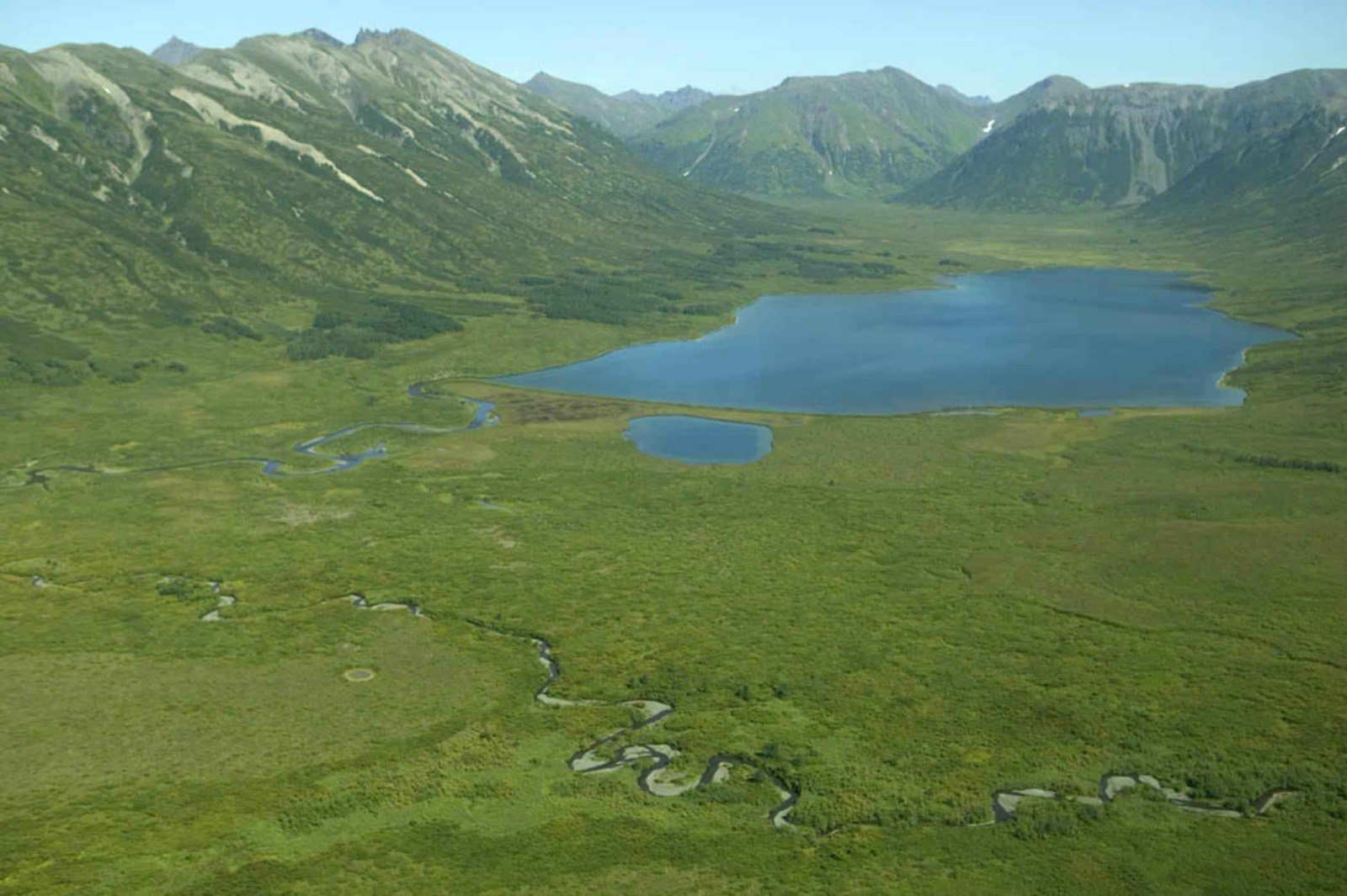 Mountain valley and lake — landscape and adventure travel